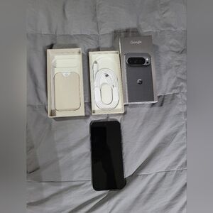 Google Pixel 10 Pro XL phone with black finish and white cable